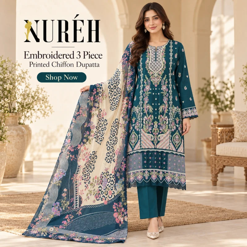A woman models a three-piece embroidered chiffon dupatta set by NURÉH. The set includes a teal kurta with intricate floral embroidery, matching teal trousers, and a large printed dupatta in beige and teal with pink floral motifs.
