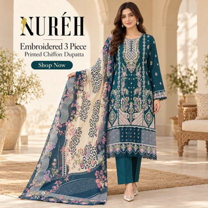 A woman models a three-piece embroidered chiffon dupatta set by NURÉH. The set includes a teal kurta with intricate floral embroidery, matching teal trousers, and a large printed dupatta in beige and teal with pink floral motifs.