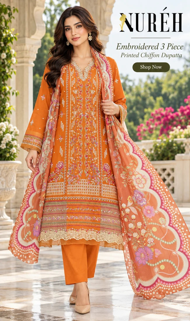 A woman models a three-piece orange ethnic suit with intricate gold embroidery and a matching printed dupatta in an outdoor garden setting. The brand name NURÉH is displayed at the top right with promotional text.
